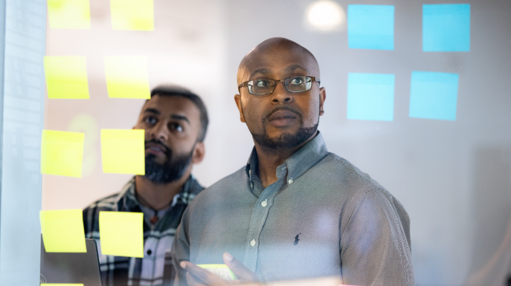 Two professionals collaborating on workforce planning in a modern office setting